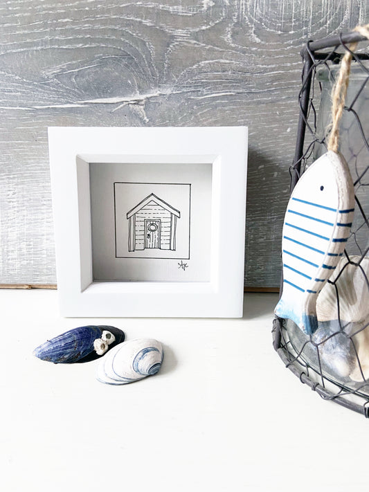 Limited edition framed Beach Hut hand-drawn illustration by Ali Collins, presented in a white gift box