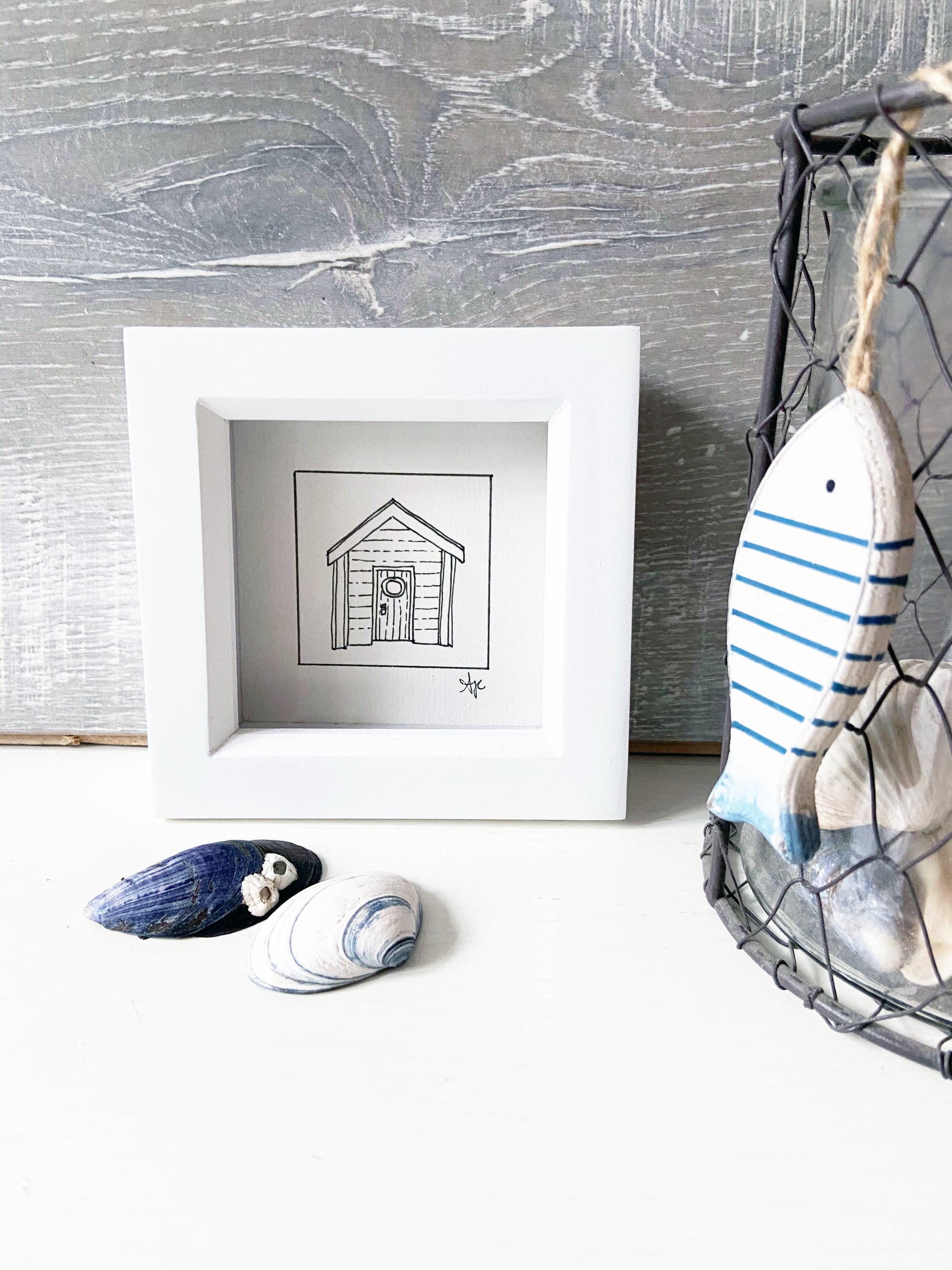 Limited edition framed Beach Hut hand-drawn illustration by Ali Collins, presented in a white gift box