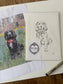Packaged dog illustration and a photo of a dog in flowers, on a wooden surface.