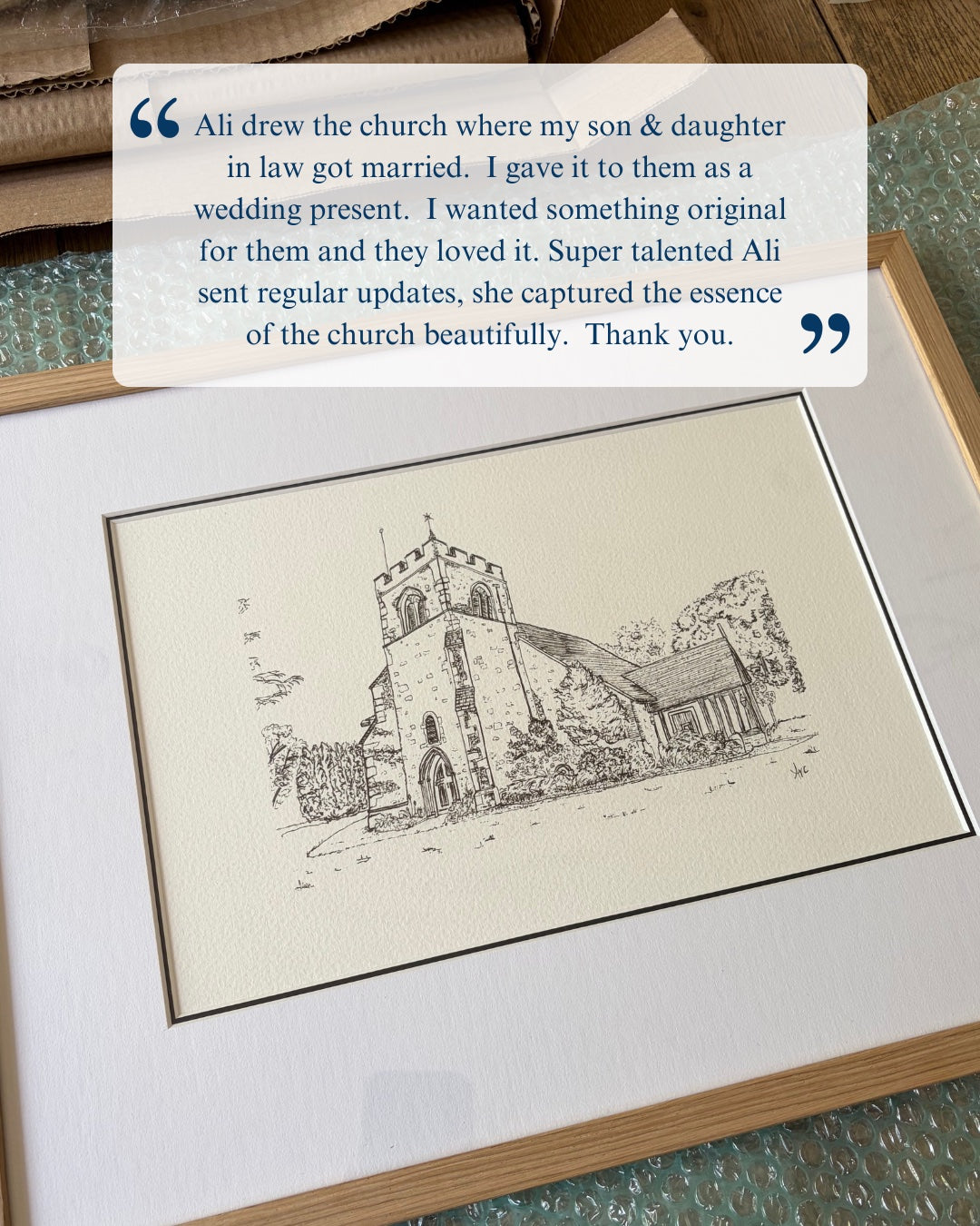 Framed drawing of a church with a customer review above it.