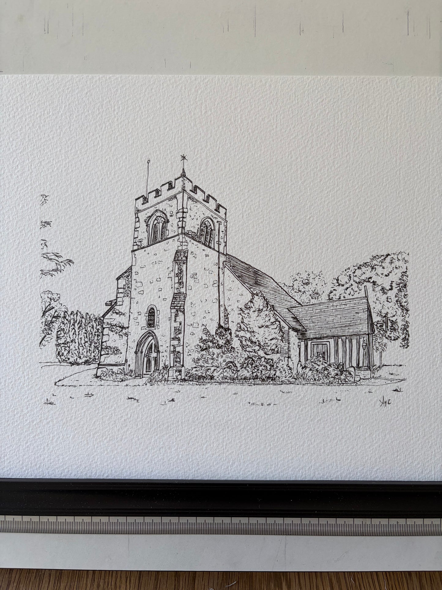 Black and white pen drawing of a church on textured paper.
