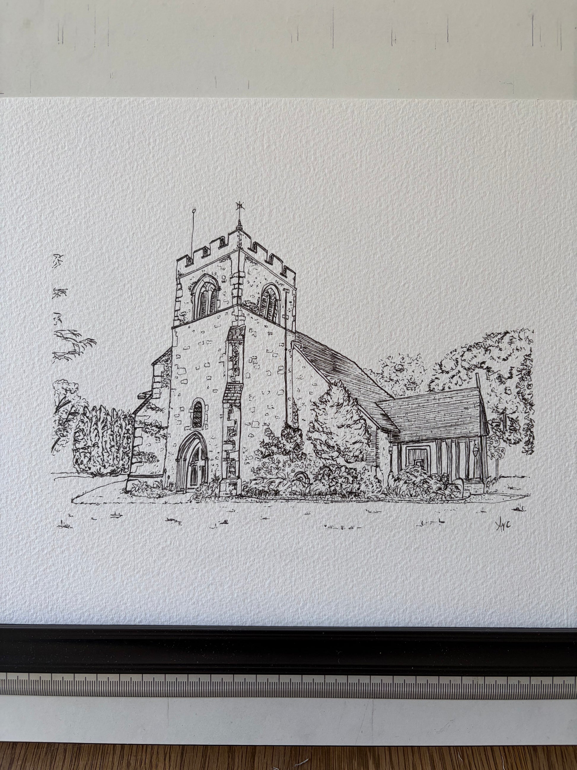 Black and white pen drawing of a church on textured paper.