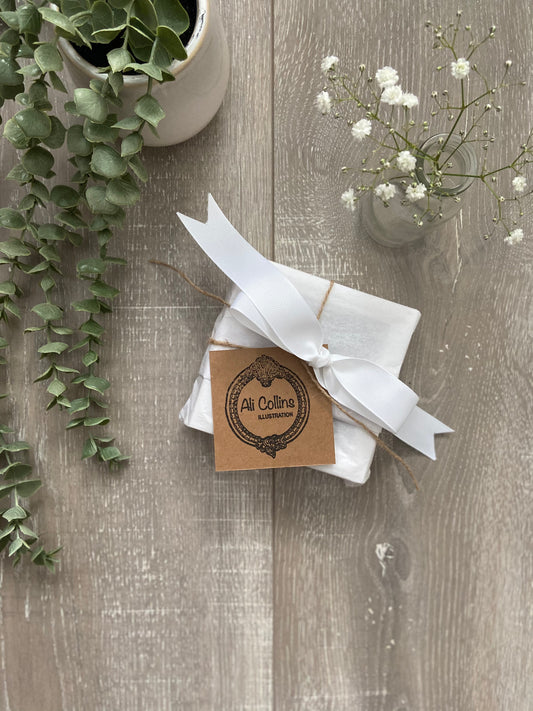 Framed Starfish illustration wrapped in acid-free tissue paper with white satin bow by Ali Collins