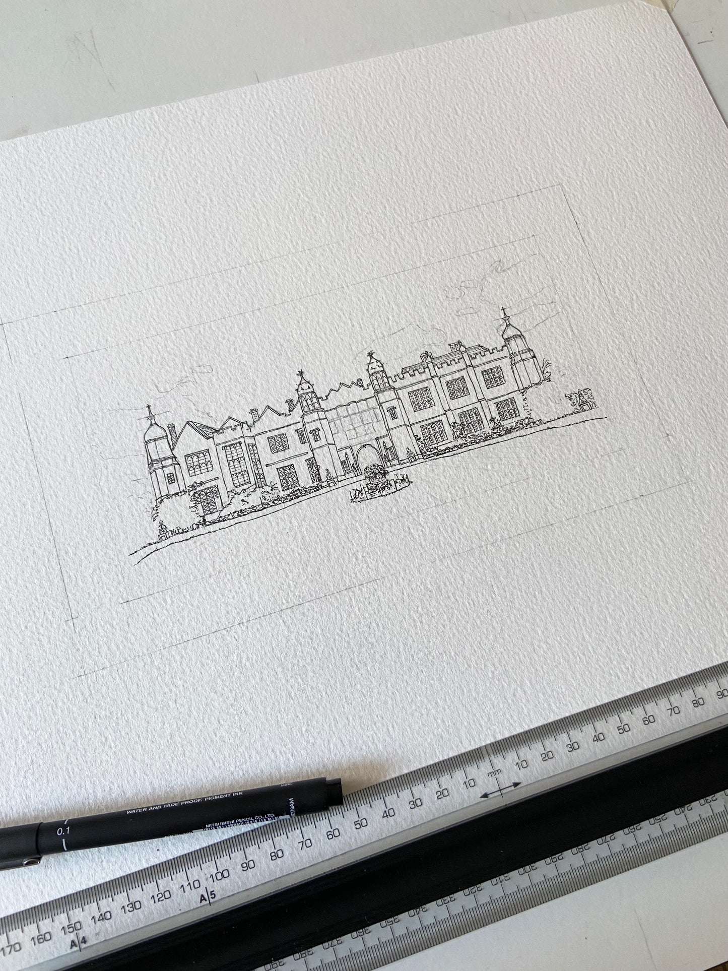 Detailed architectural drawing on a white sheet of paper with a ruler at the bottom.